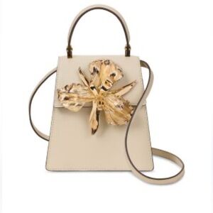 Cult Gaia Elegant Beige Top-Handle Bag with Gold Floral Accent